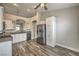 Spacious kitchen featuring stainless steel appliances, white cabinetry, and granite countertops at 4731 Norwegian St, Las Vegas, NV 89147