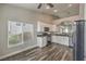 Well-lit kitchen with stainless steel appliances, modern cabinetry, and wood-look flooring at 4731 Norwegian St, Las Vegas, NV 89147