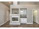 Cozy living room featuring a fireplace, built-in cabinets, and wood-look floors at 4731 Norwegian St, Las Vegas, NV 89147