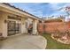 An outdoor covered patio perfect for entertaining, complete with a grill and outdoor ceiling fan at 4731 Norwegian St, Las Vegas, NV 89147