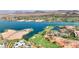 Aerial view of lakefront property with resort amenities at 5 Highland Cove Ln, Henderson, NV 89011