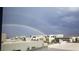 Rainbow over community of modern homes with mountain views at 5 Highland Cove Ln, Henderson, NV 89011