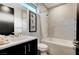 Modern bathroom with soaking tub, shower, and dark vanity at 5 Highland Cove Ln, Henderson, NV 89011