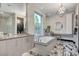 Spa-like bathroom with soaking tub and modern vanity at 5 Highland Cove Ln, Henderson, NV 89011