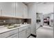 Bright kitchen with white cabinets and stone countertops at 5 Highland Cove Ln, Henderson, NV 89011