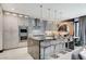 Modern kitchen with stainless steel appliances and large island at 5 Highland Cove Ln, Henderson, NV 89011