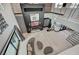 High-ceiling living room with a modern fireplace and seating at 5 Highland Cove Ln, Henderson, NV 89011