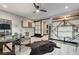 Modern home office with glass-top desk and barn door at 5 Highland Cove Ln, Henderson, NV 89011