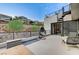 Private patio with spiral staircase, seating, and city views at 5 Highland Cove Ln, Henderson, NV 89011