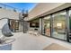 Modern patio with spiral staircase, seating area, and fireplace at 5 Highland Cove Ln, Henderson, NV 89011