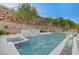 Resort-style pool and spa with a cascading waterfall feature at 5 Highland Cove Ln, Henderson, NV 89011