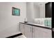 Elegant powder room with modern vanity and dark countertop at 5 Highland Cove Ln, Henderson, NV 89011