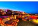 Evening view of rooftop deck with seating and outdoor kitchen at 5 Highland Cove Ln, Henderson, NV 89011