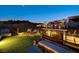 Night view of rooftop deck with lounge area and outdoor kitchen at 5 Highland Cove Ln, Henderson, NV 89011