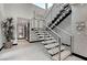 Modern floating staircase with metal railing and light wood steps at 5 Highland Cove Ln, Henderson, NV 89011