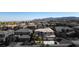 Aerial view of two story house with a three car garage, palm trees, and mountain views at 528 Copper View St, Henderson, NV 89052