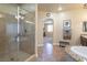 Bathroom with a walk-in shower and large vanity at 528 Copper View St, Henderson, NV 89052