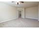 Spacious bedroom with carpet, ceiling fan and access to hallway at 528 Copper View St, Henderson, NV 89052