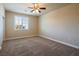 Bedroom with carpet, ceiling fan and window with shutters at 528 Copper View St, Henderson, NV 89052