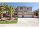 Two-story house with three-car garage and palm trees at 528 Copper View St, Henderson, NV 89052