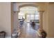 View through an arched entryway into the living room and kitchen at 528 Copper View St, Henderson, NV 89052