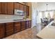 Kitchen boasts dark wood cabinets and granite countertops at 528 Copper View St, Henderson, NV 89052