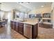 Spacious kitchen with island, stainless steel appliances, and ample cabinetry at 528 Copper View St, Henderson, NV 89052