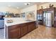 Kitchen has stainless steel appliances, granite counters, and a center island at 528 Copper View St, Henderson, NV 89052