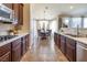 Open kitchen with breakfast nook and dark wood cabinets at 528 Copper View St, Henderson, NV 89052