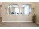 Partial wall with arched openings separating rooms at 528 Copper View St, Henderson, NV 89052