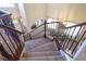 Elegant staircase with wrought iron railing leading to upper level at 528 Copper View St, Henderson, NV 89052