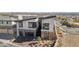 An aerial view of the modern home, showcasing its desert landscaping, angular design, and proximity to the city at 5436 Succulent Rose Dr, Las Vegas, NV 89135