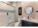 Clean bathroom featuring a shower-over-tub combo with glass doors and modern fixtures at 5436 Succulent Rose Dr, Las Vegas, NV 89135