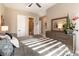 Sun-drenched bedroom featuring modern furnishings and a view of the ensuite bathroom at 5436 Succulent Rose Dr, Las Vegas, NV 89135