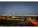 Nighttime view of a baseball field with city skyline in the distance at 5436 Succulent Rose Dr, Las Vegas, NV 89135