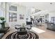 Open floor plan featuring a dining area adjacent to the kitchen and living room, highlighted by large windows and natural light at 5436 Succulent Rose Dr, Las Vegas, NV 89135