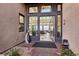 Welcoming foyer with a modern front door, stone accents, and glimpses of the home's stylish interior at 5436 Succulent Rose Dr, Las Vegas, NV 89135