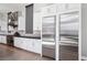 Bright kitchen with stainless steel appliances, sleek cabinetry and a modern design adjacent to the dining area at 5436 Succulent Rose Dr, Las Vegas, NV 89135