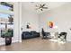 Bright living room with tall ceilings, modern decor, comfortable seating, and plenty of natural light at 5436 Succulent Rose Dr, Las Vegas, NV 89135