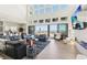 Spacious living room featuring a seamless indoor-outdoor flow to a patio and pool area at 5436 Succulent Rose Dr, Las Vegas, NV 89135