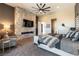 Luxurious main bedroom boasts a stone accent wall with fireplace and a comfortable sitting area at 5436 Succulent Rose Dr, Las Vegas, NV 89135