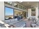 Expansive patio with outdoor seating flowing into the living area through sliding glass doors at 5436 Succulent Rose Dr, Las Vegas, NV 89135