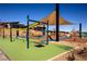 Bright and colorful community playground with various play structures and soft surfaces for  at 5436 Succulent Rose Dr, Las Vegas, NV 89135