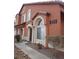 Two-story stucco house with arched entryway and large windows at 5459 Cactus Thorn Ave, Las Vegas, NV 89118