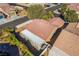 An aerial view of a desert home in a neighborhood showing the covered patio and tile roof at 551 Morning Mauve Ave, Las Vegas, NV 89183