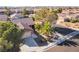 Aerial view of a well-maintained home with a tile roof and mature landscaping in a suburban neighborhood at 551 Morning Mauve Ave, Las Vegas, NV 89183