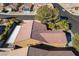 Overhead view of a desert home with a patio cover and tile roof in a residential neighborhood at 551 Morning Mauve Ave, Las Vegas, NV 89183