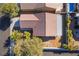 Aerial view of single-story home with covered patio and desert landscaping at 551 Morning Mauve Ave, Las Vegas, NV 89183