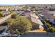 Single-story home features desert landscaping and a backyard with covered patio in a neighborhood at 551 Morning Mauve Ave, Las Vegas, NV 89183