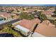 Aerial view of a desert home showcasing a tile roof and patio cover in a residential area at 551 Morning Mauve Ave, Las Vegas, NV 89183